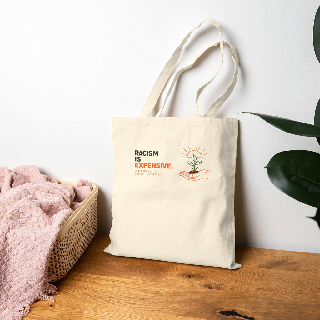 Canvas Tote Bag — "Racism Is Expensive" Eco-Friendly Shopper with Hopeful Plant Design